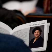 a guest looking at a program